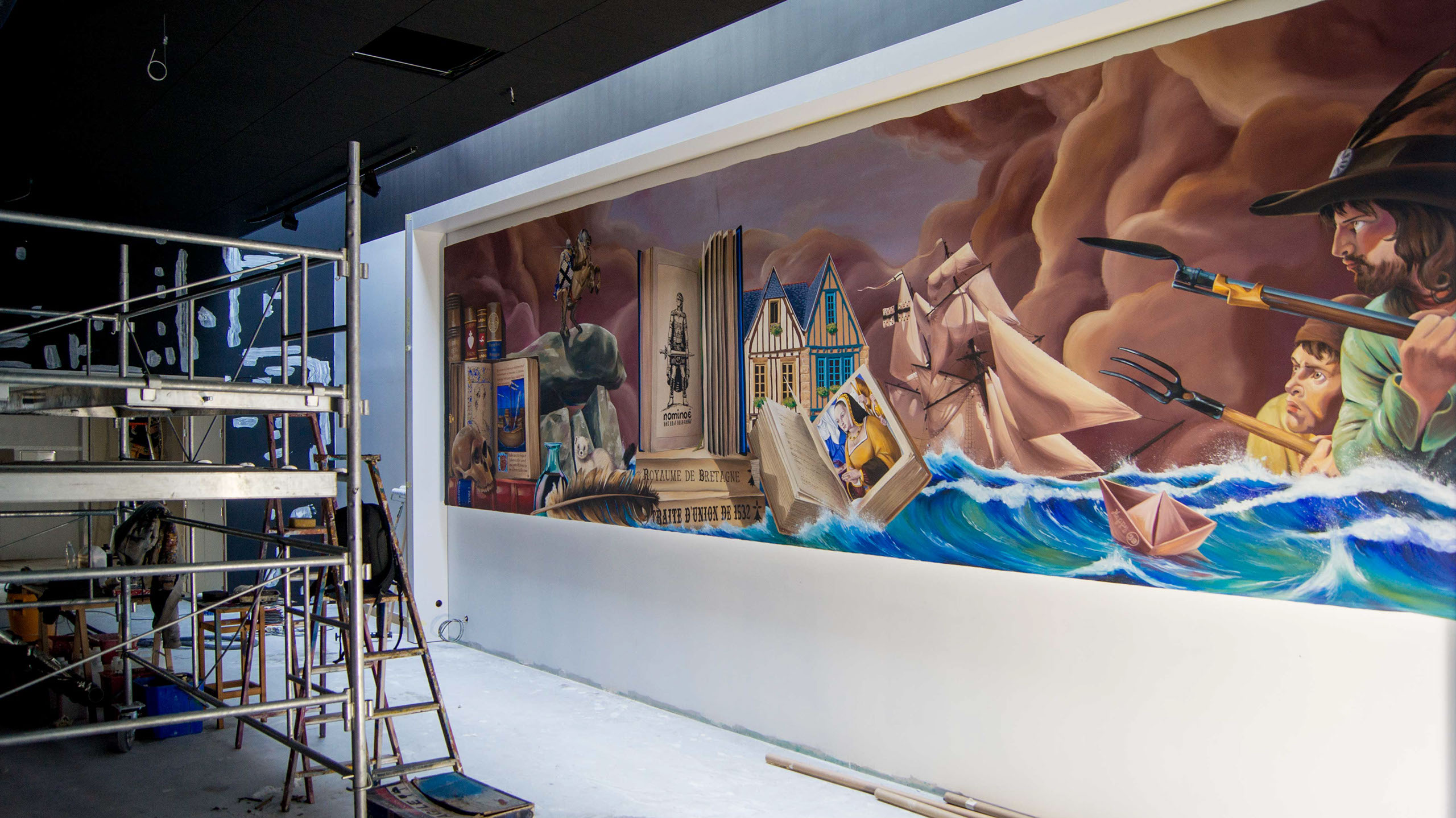 cette image représente  une oeuvre de street art peinte en trompe-l'oeil et réaliser sur un pignon façe au présidial à Guerlesquin.